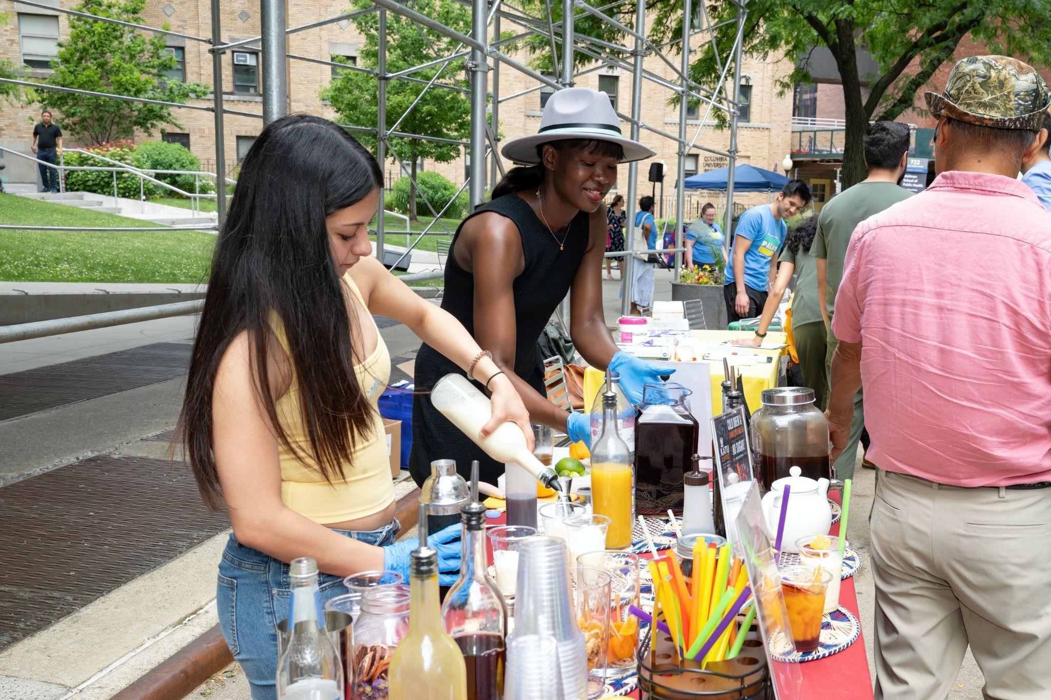 Let's Move US volunteers pouring drinks at the refreshments table